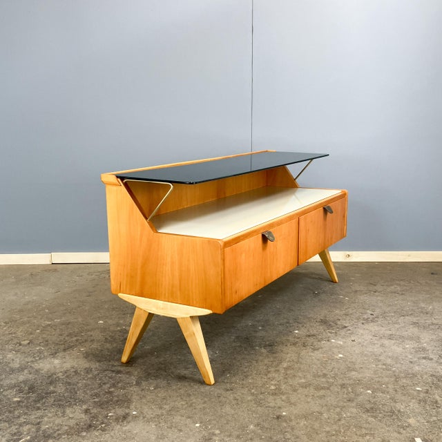 A beautiful chest of drawers from the German workshop for interior design, whose distinctive style evokes the 1950s. A...