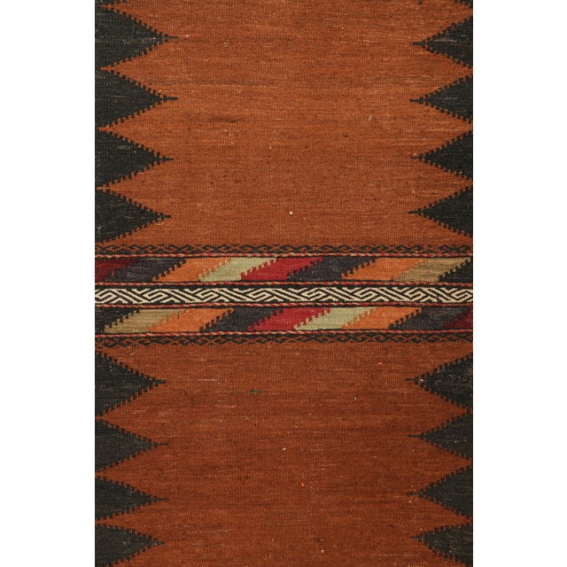 Handwoven in wool, circa 1950-1960, this 2×5 vintage Afghan tribal kilim, is a collectible tribal piece that may have been...