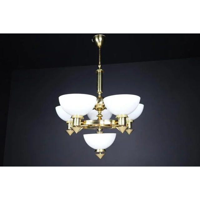 Sculptural italian chandelier in brass & white opaline glass, 1970s – 12 available elegant and structurally bold, this...