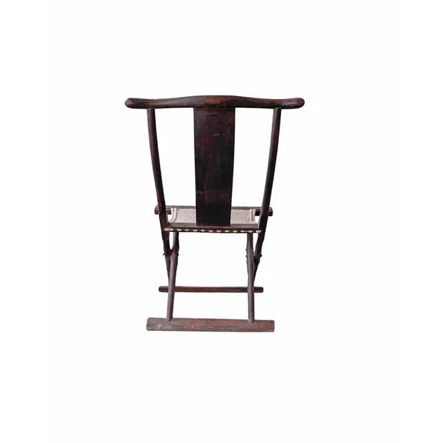 This folding chair from the early 20th Century was once used by Chinese Travellers. The seat is crafted from woven fabric,...
