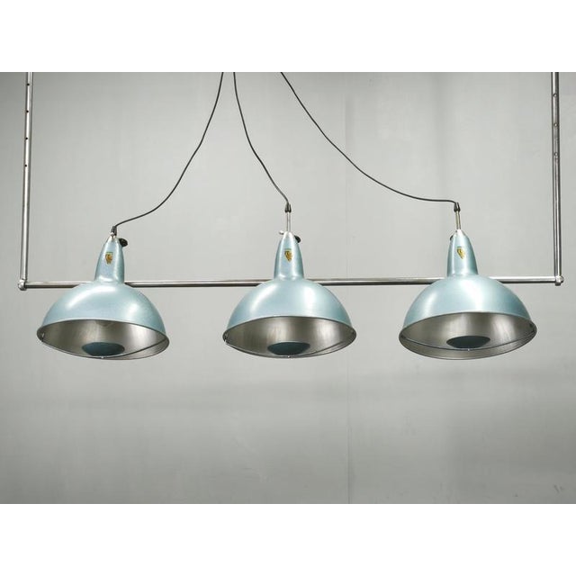 Rare large-scale adjustable three-light chandelier by a.l.f. Firenze, manufactured in italy during the 1970s. An...