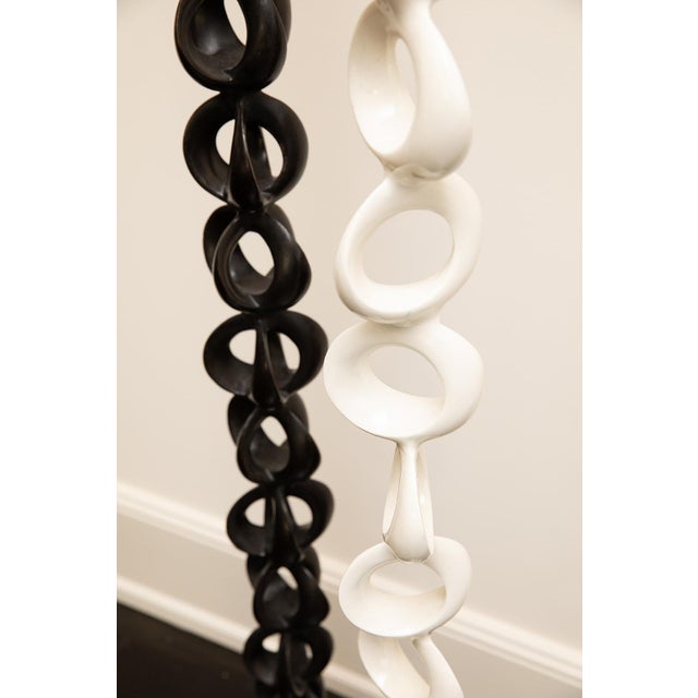 This striking bronze sculpture by Miki Gutierrez features slender vertical forms with a smooth enamel finish in white. The...
