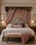 A dramatic carved giltwood bed cornice (tester), designed to mount above a headboard and dress the bed with draped curtain...