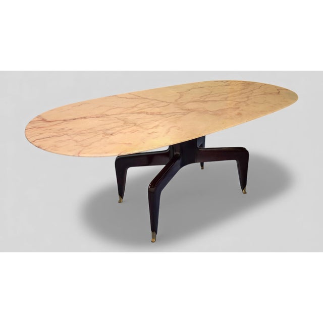 Italian Mid Century Dining Table designed by Melchiorre Bega in 1950s, Portuguese pink marble top, a highly prestigious...