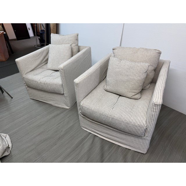 Design Plus Gallery presents a Pair of Millie Club Chairs by Verellon. The chairs have a sleek and modern design with...