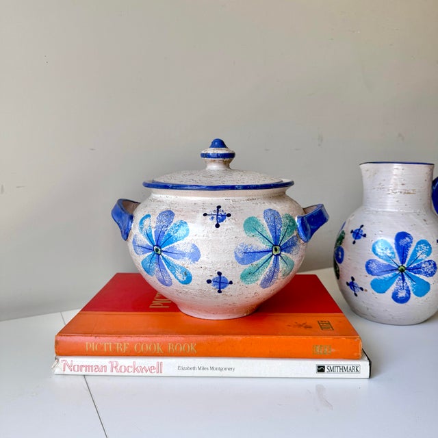Vintage mid-century modern Bitossi pottery blue floral soup tureen with blue and green floral and starburst painted pattern.