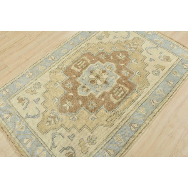This tribal geometric Anatolia rug is hand-knotted with an all-wool pile on a cotton foundation. This rug is new and in...
