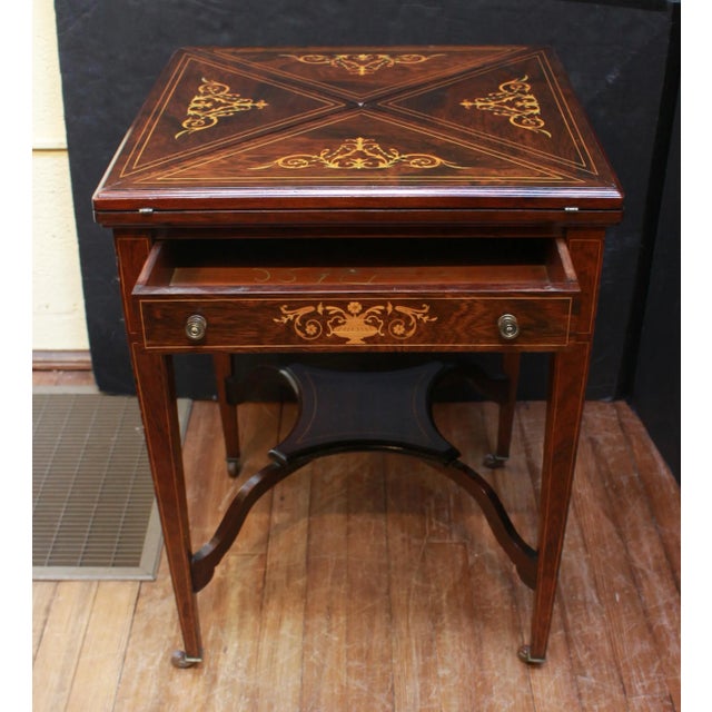 Late 19th-early 20th century English handkerchief form games table. Late Victorian to Edwardian era. In the neoclassical...