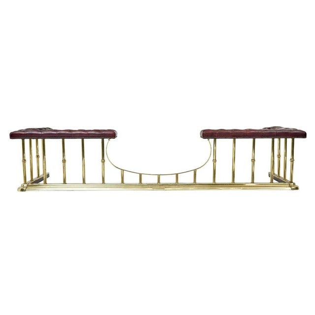 large brass and leather fireplace club fender circa 2000. popular model of a victorian design. at over 8 foot long this...