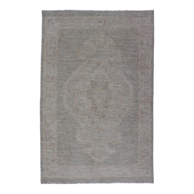Modern Oushak With Off Gray Background With a Large Tribal Medallion in Cream For Sale