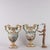 Pair of Capodimonte ceramic vases with relief decorations depicting mythological scenes. Taken in the shape of female...