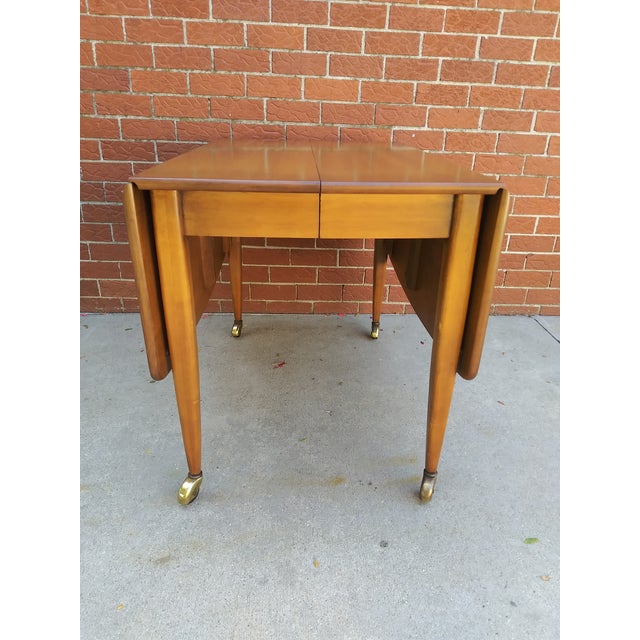 Beautiful solid wood drop leaf dining table by C. H. Willett. This piece is very well made and was built to last. It...