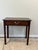 This sweet English side table features a storage drawer with a lovely brass pull. The finish has a rich character and a...