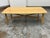 Design Plus Gallery presents the Brezza Light Oak Coffee Table from Article. The table has a rectangular oak-toned...