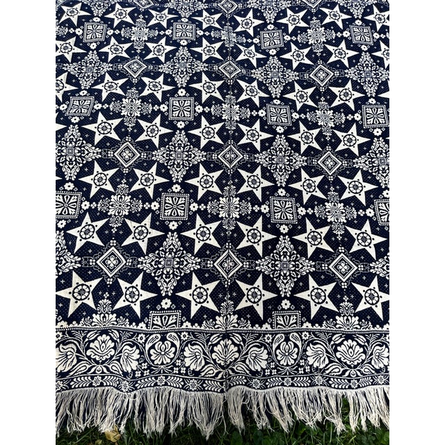 An indigo and white circa 1860s hand loomed coverlet. In excellent condition