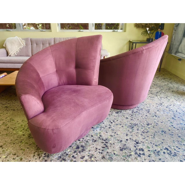Fabulous vintage pair of asymmetrical tufted back swivel chairs in aubergine ultra suede, after the Nautilus lounge chairs...