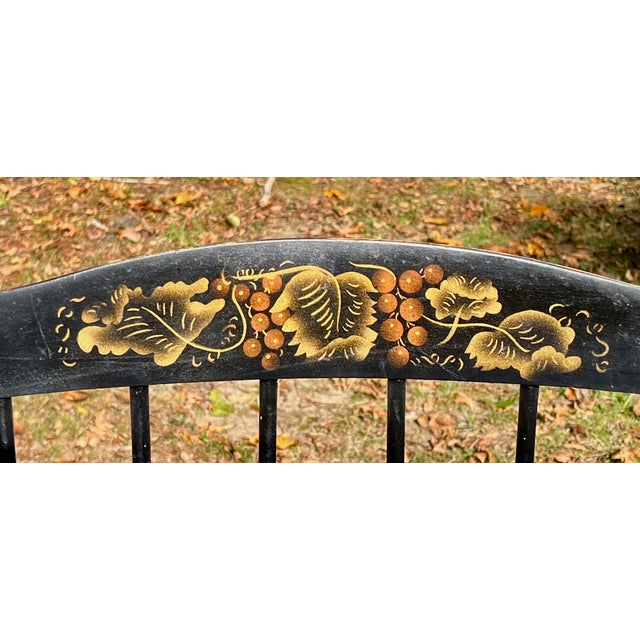 A rich, warm patina adds to the splendor of this set of four (4) black Hitchcock fan back windsor chairs. They all match....