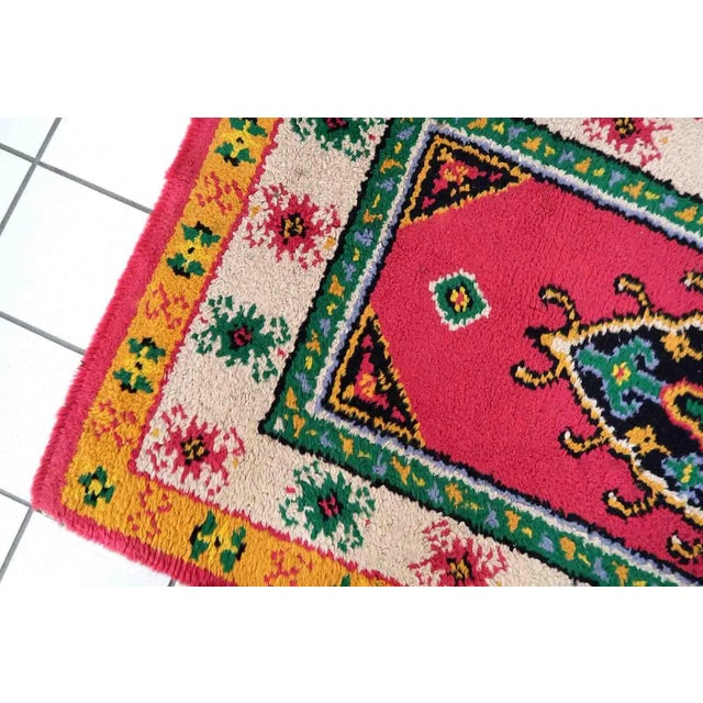 Vintage French Savonnerie rug in bright pink color. The rug has been made in wool in the end of 20th century. It is in...