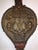 Intricately carved Italian fire bellows decorated with winged gri ns, roaring lion head and torch and coat of arms and on...