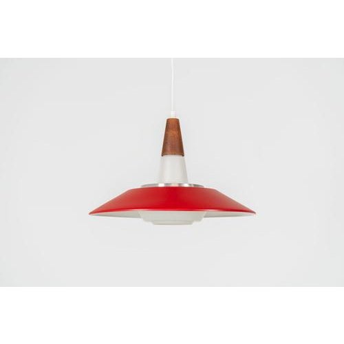 Pendant light by Voss Belysning (Denmark, 1960s). A stunning piece of lighting, made out of an opaline glass body, a vivid...