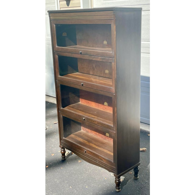 Offered is a vintage Gunn barrister style bookcase. While most barrister bookcases are sectional this one is not. It is...