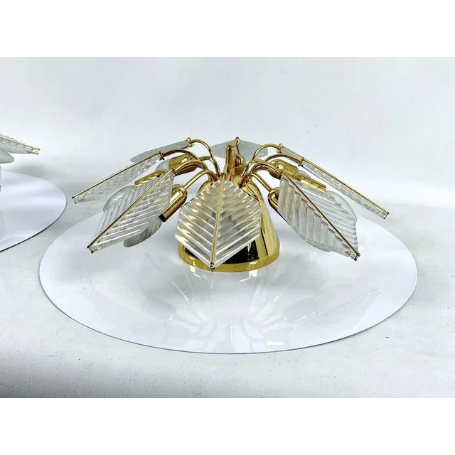 Excellent condition with normal trace of age and use for this set of two brass and glass ceiling lamps produced by zero...