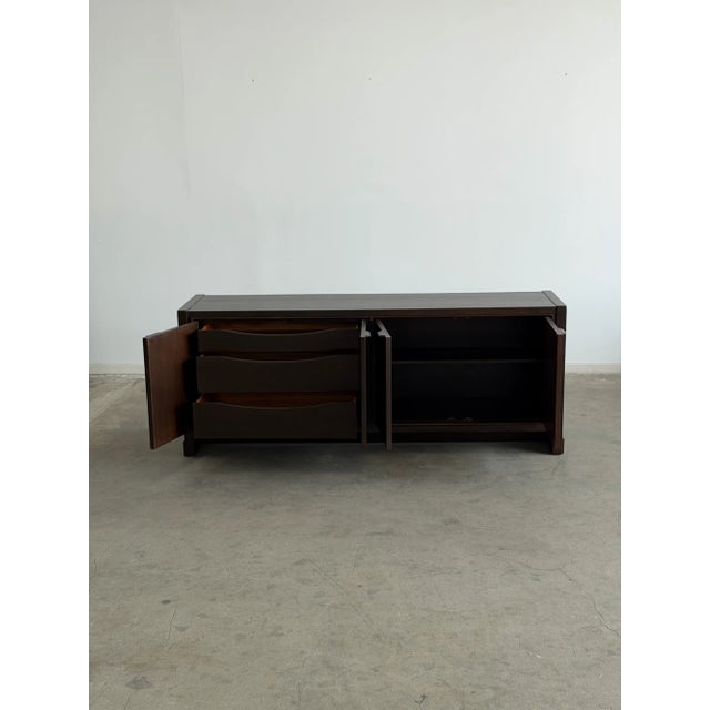 W76 D19 H30.5 The 1970’s Oak Parquet Credenza is an ideal anchor for any space. This vintage piece from the "Furniture of...