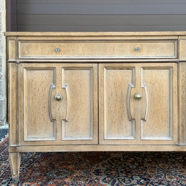 A vintage Louis XVI credenza having two drawers over a pair of two door cabinets, each with an adjustable shelf and square...