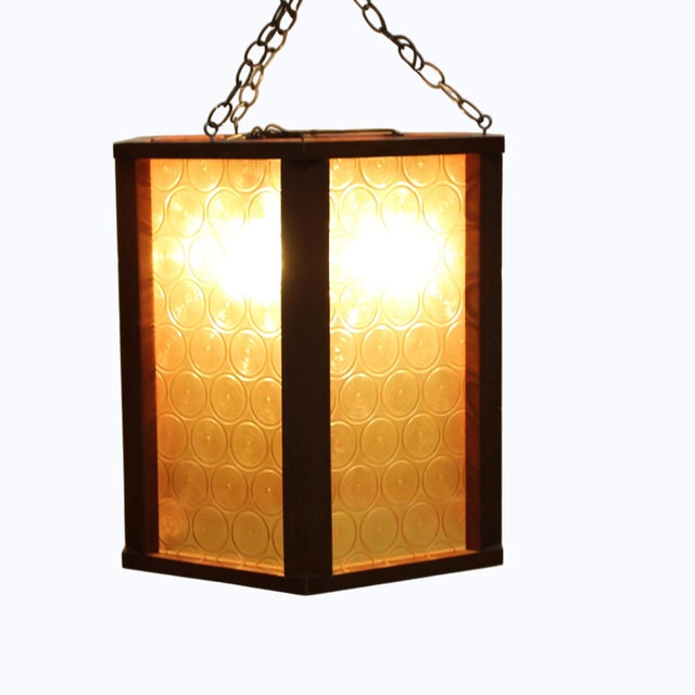 Mid-Century Modern hanging pendant. 3 standard size light sockets. Solid wood frame in a classic hexagonal lantern shape,...