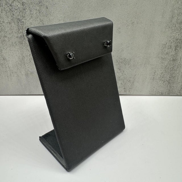 These elegant Black Diamond Studs in 10kt white gold feature 0.50ctw of round black diamonds, set with black rhodium-...