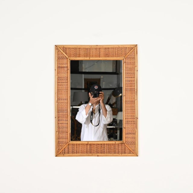 Wonderful Mid-Century large rectangular mirror entirely made in bamboo and woven rattan wicker. This unique French Riviera...