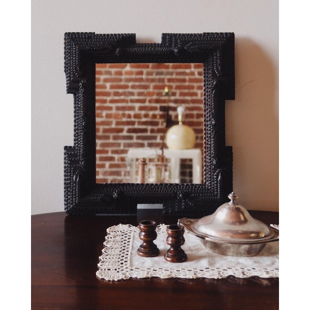 Late nineteenth century hand carved tramp art mirror constructed from layered wood using the traditional chip carving...
