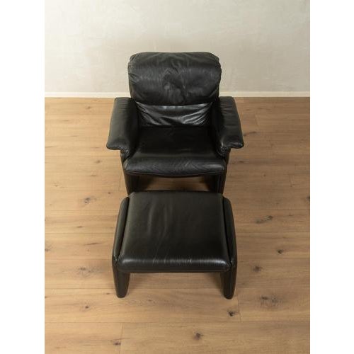 Lounge chair with footstool, cor accomplished design: perfect proportions and unmistakable attention to detail.high-...