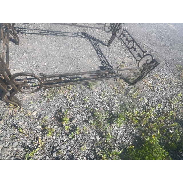Up for sale is a sturdy, solid heavy wrought iron coffee table base featuring ornate scrollwork sides, central ring...