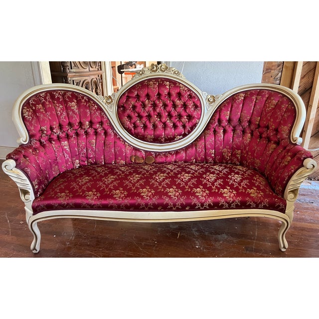 A showstopper trio in the grand Victorian Rococo Revival style tradition — three matched pieces with hand-carved frames,...