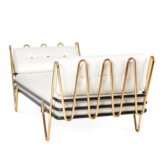 Sinuous, sculptural, surprising—our Maxime Daybed hits all the right notes. A gleaming brass frame cradles a gracious and...