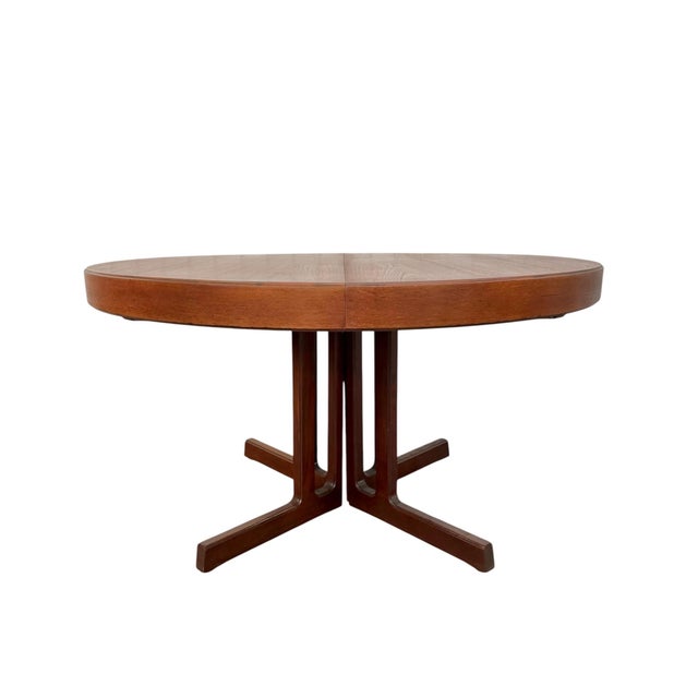 Elevate your dining space with this handsome Mid-Century Danish Modern teak dining table, dating to the 1960s. Featuring a...