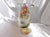 This is a coffee pot with a peach rose design with green leaves. It is marked Made in Germany as shown. The front (handle...