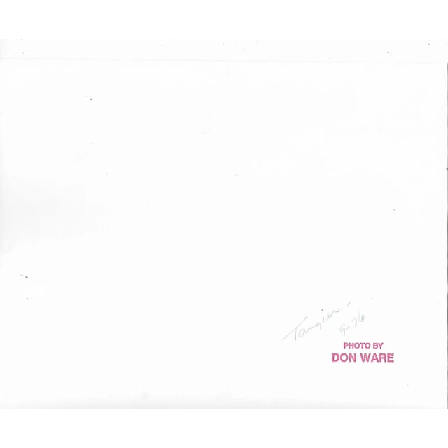 1976 black and white photograph by Los Angeles based photographer Don Ware of street vendors in Morocco. Titled, dated and...