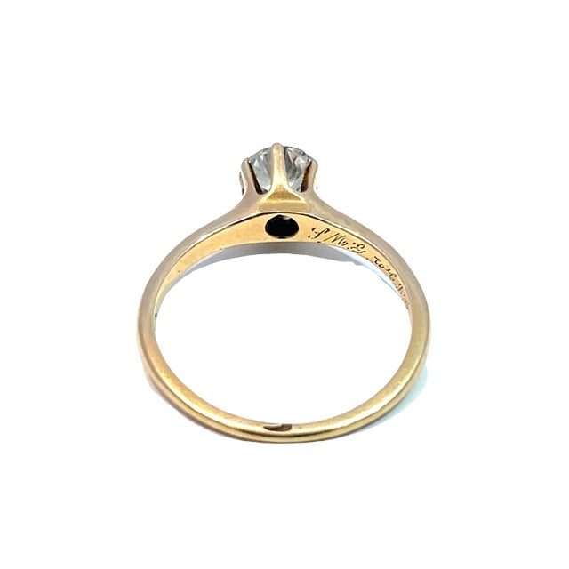 Celebrate your love with this exquisite 14k yellow gold wedding ring, featuring a stunning diamond that radiates elegance...