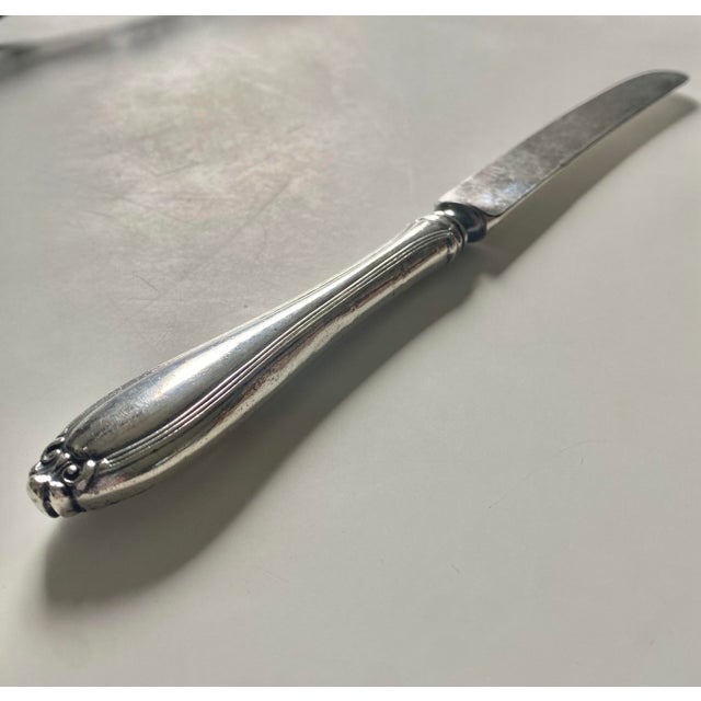 Knife by Alvin Sterling. 1907 "Evangeline" pattern by Frederick Habensac. Faintly marked “Alvin Sterling” to the handle....