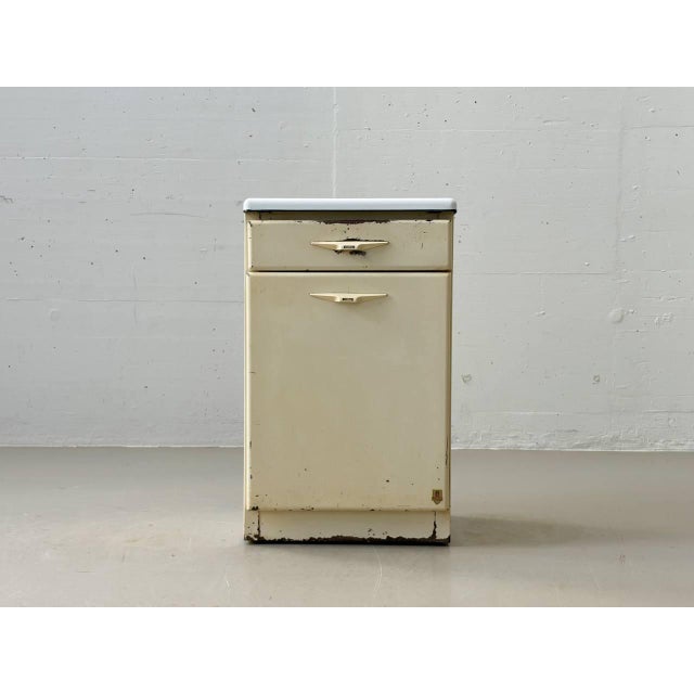 A characterful industrial chest of drawers made of lacquered sheet steel by the french manufacturer r. Daurat from the...