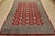 A tribal Bokhara Jaldar rug hand-knotted with fine wool on a cotton foundation. This rug features rows of repeating...