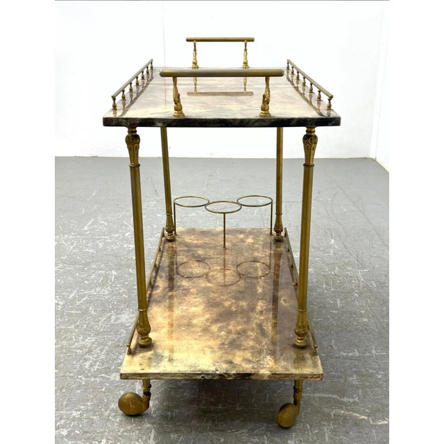 This stunning 1960's bar cart by Italian designer Aldo Tura features two 2 level in brown dyed goatskin all supported by...