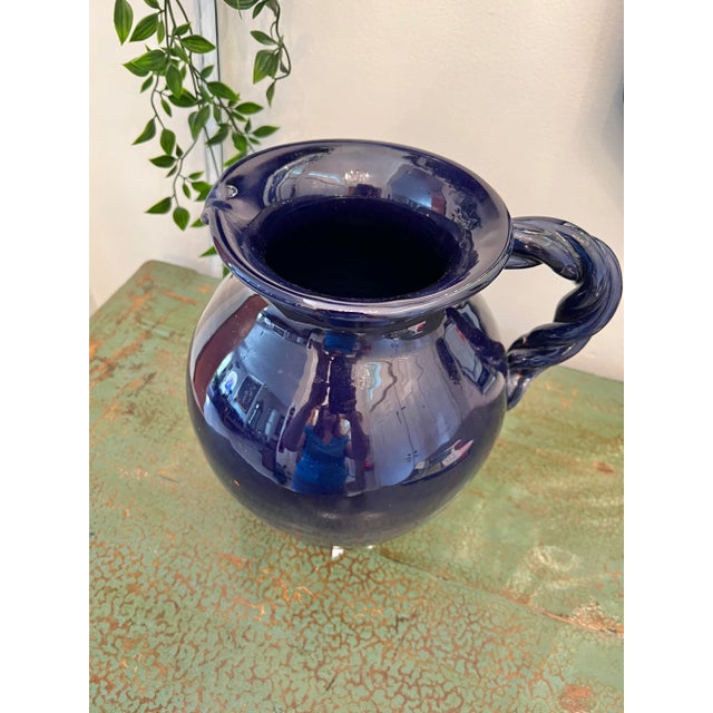 Dark blue ceramic pottery pitcher. Made in Italy.