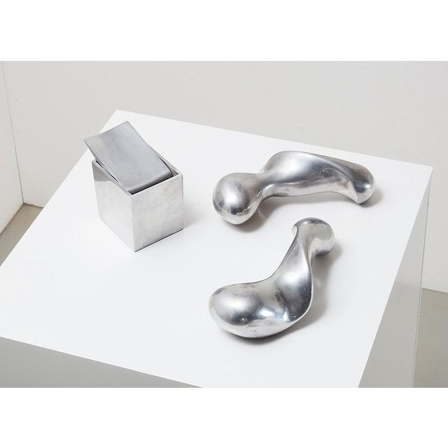 Ray hollis ashtray + set of poaa dumbbells, designed by philippe starck for xo france, that he co-founded. both are marked...