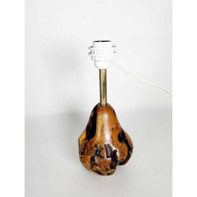 The lampshade is not included. A charming, handcrafted table lamp made from a solid olive wood burl, showcasing the...