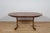 This is an oval-shaped teak dining table manufactured by G-Plan in the 1960s. The dining table after a comprehensive...