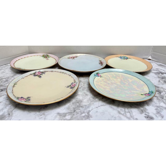 Vintage assortment of floral patterned porcelain ceramic side dishes or dessert dishes, set of five. Violets and pale pink...