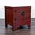 Red lacquer cabinet with interior shelf and metal hardware. Dimensions (in): 27W x 19D x 26H.